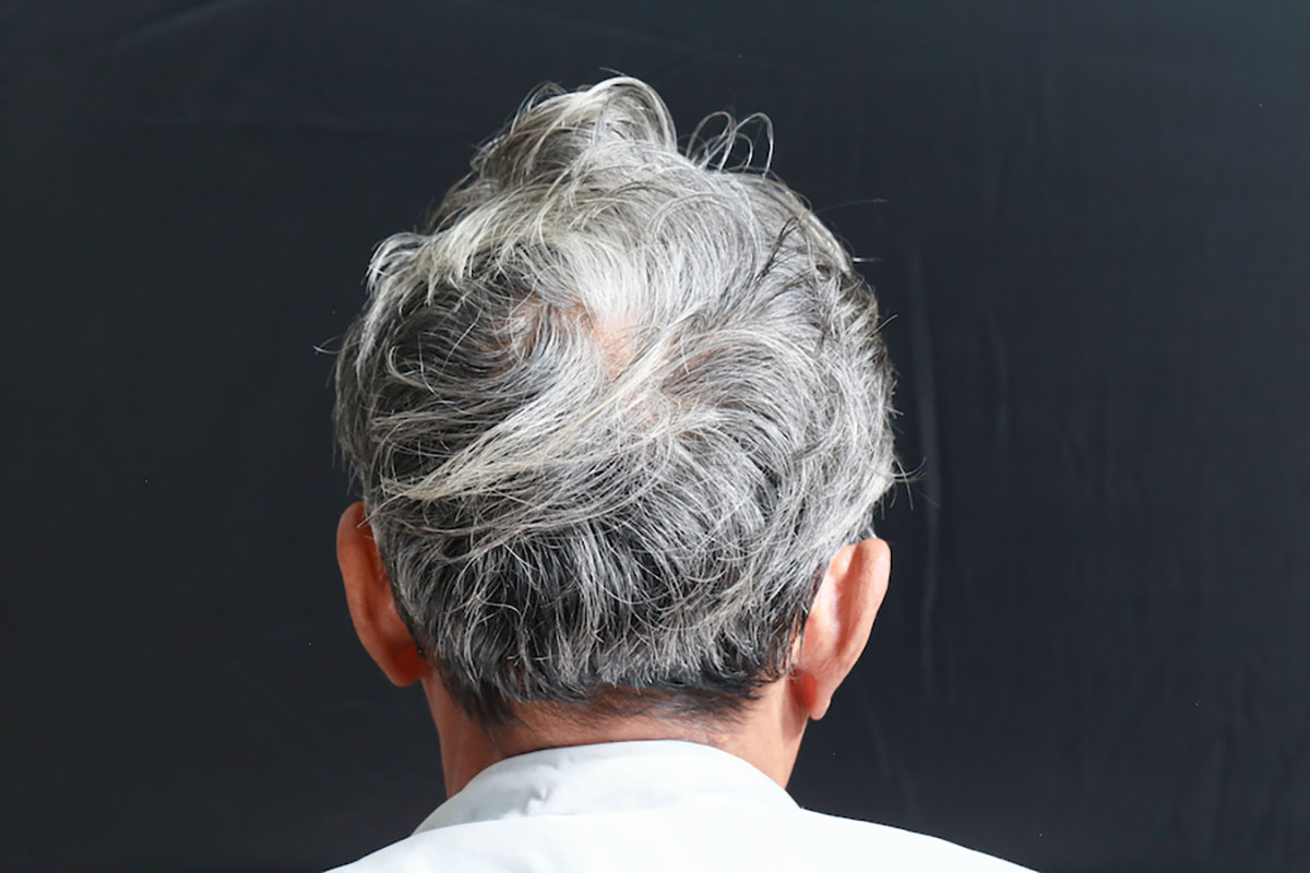 Back view gray hair man.